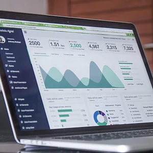 Laptop showing financial charts